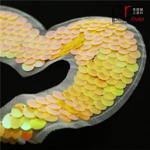 Oranssi sydämenmuotoinen paljettilaastari