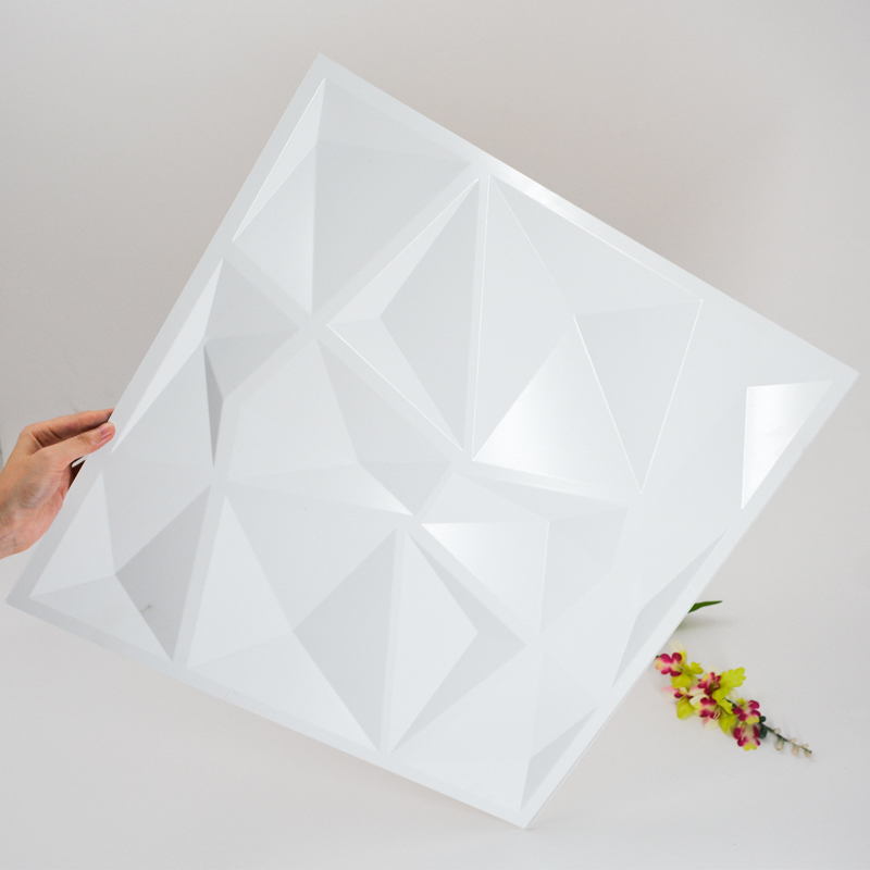 Moderni 1 mm: n paksu valkoinen PVC-muovinen 3D-seinäpaneeli sisätilojen sisustamiseen