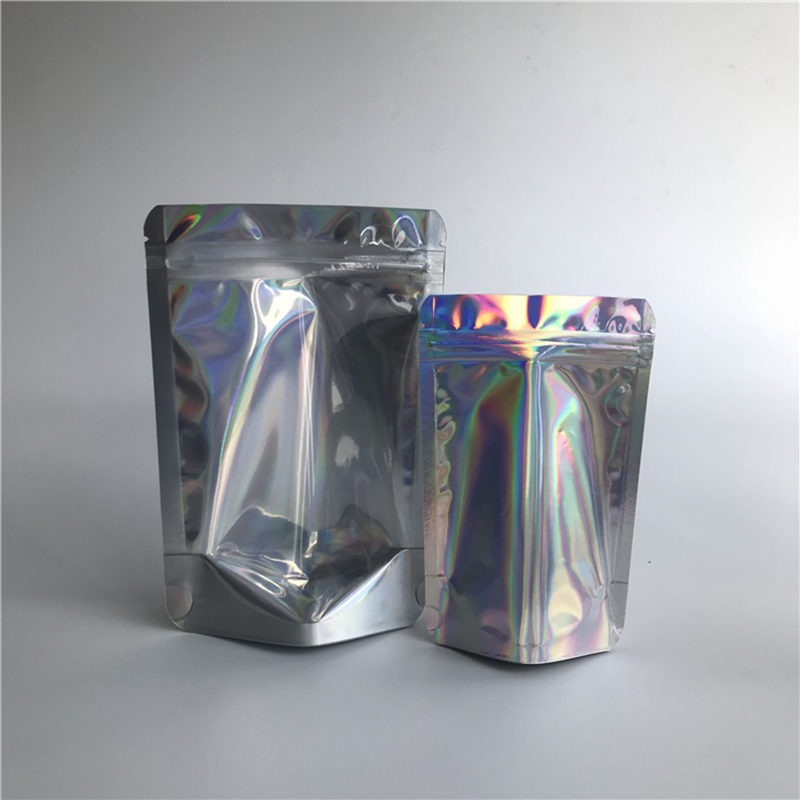 Tukku-uudelleenlämmitettävät läpinäkyvät edessä olevat holografiset stand up -laukut, laminoidut muoviset vetoketjullinen laukut, varastossa